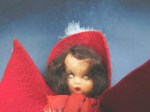 nancy ann brunette red outfit cape face